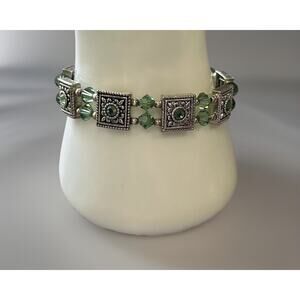 Lovely Silver Tone Bracelet with Green Peridot. Measures 7"
